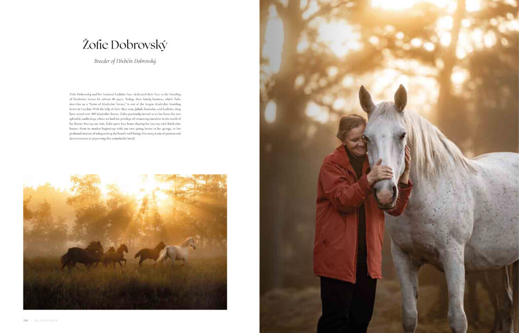 Book spread featuring breeder Žofie Dobrovský embracing a grey Kladruber horse, with a herd of Kladruber horses running through misty light on the facing page